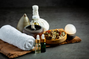 herbal compress and herbal spa treatment equipments put on dark